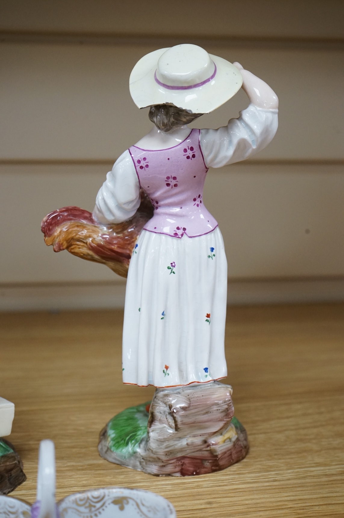 A pair of 19th century Hochst Damm faience figures and a Meissen twin section salt, tallest figure 20cm